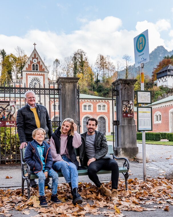 Family at the bus stop in front of the Old Salt Works