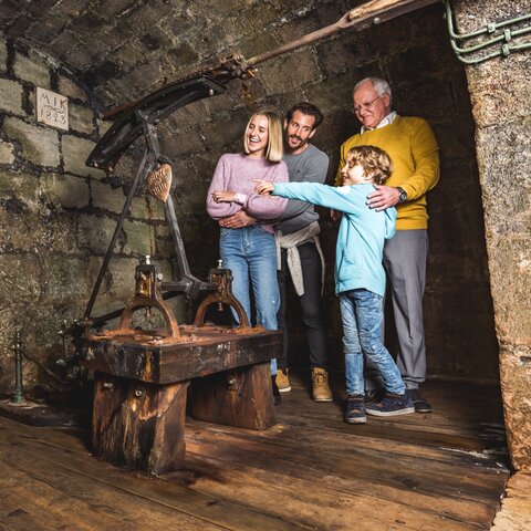 Family in front of the Karl Theodor Pump